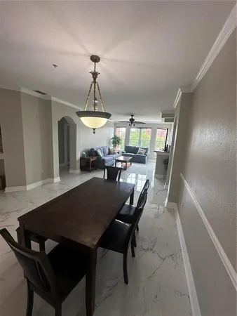 a view of a livingroom with wooden floor and a window