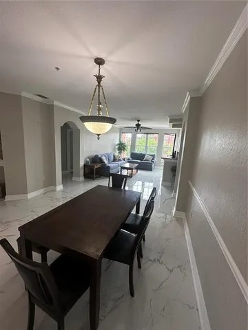 a view of a livingroom with wooden floor and a window