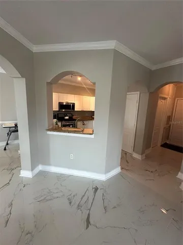 a kitchen with granite countertop a sink and counter top space