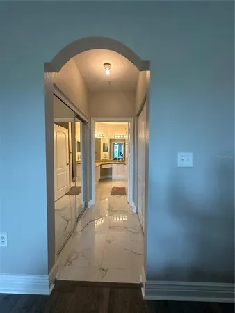 a large bathroom with a granite countertop sink a mirror and a