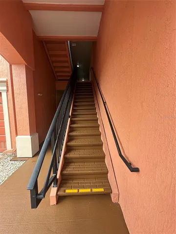 a view of a hall with a front door