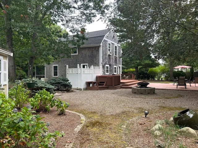a view of a street with a car parked on the roadside