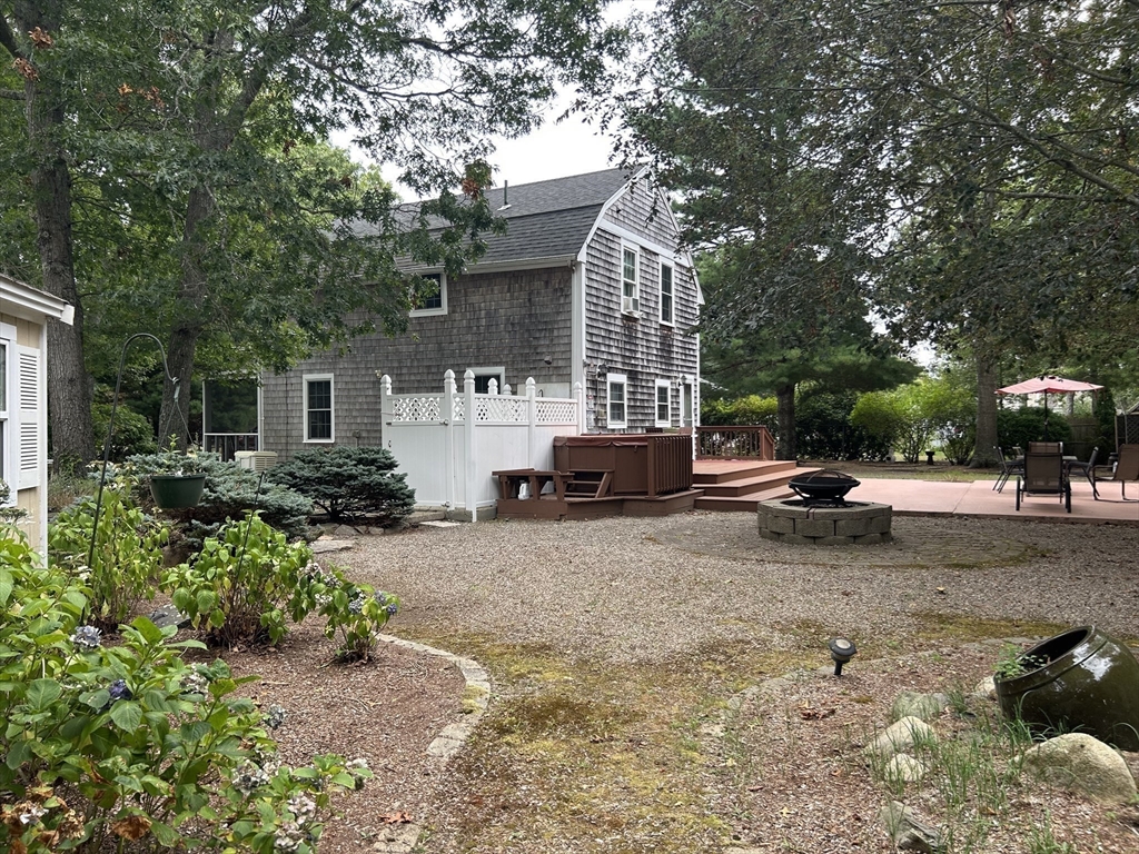 19 Rolling Acres Lane Falmouth, MA 02536 - Photo 20 of 27 a view of a street with a car parked on the roadside
