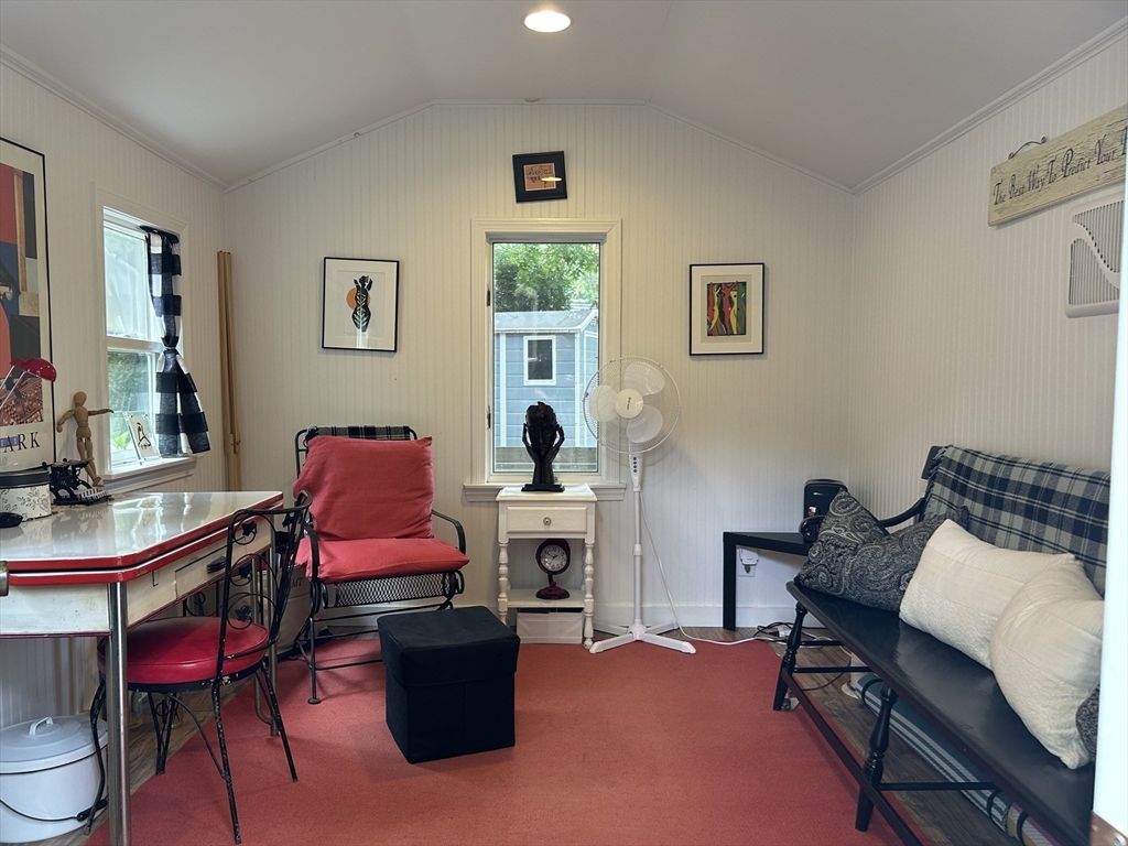 19 Rolling Acres Lane Falmouth, MA 02536 - Photo 24 of 27 a living room with furniture and a fireplace