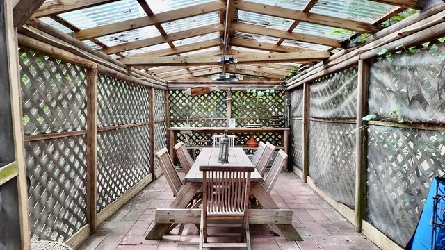 a view of balcony with furniture
