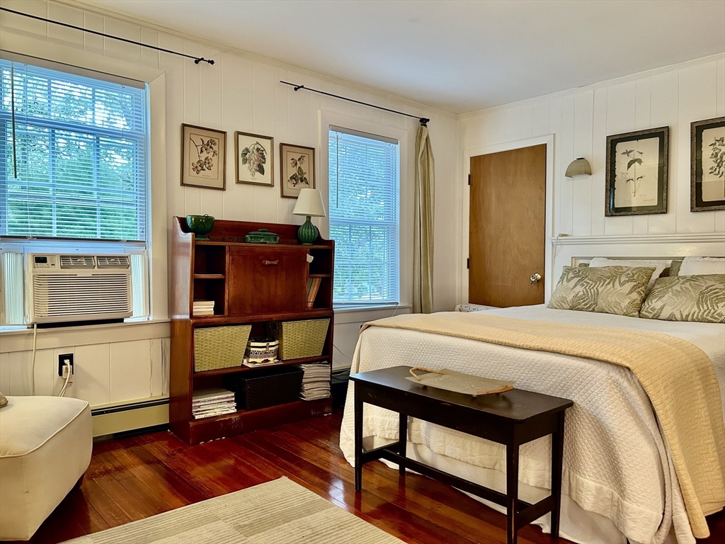 19 Rolling Acres Lane Falmouth, MA 02536 - Photo 7 of 27 a bedroom with a bed and wooden floor