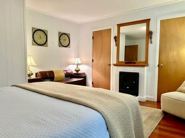 a spacious bedroom with a bed and a couch