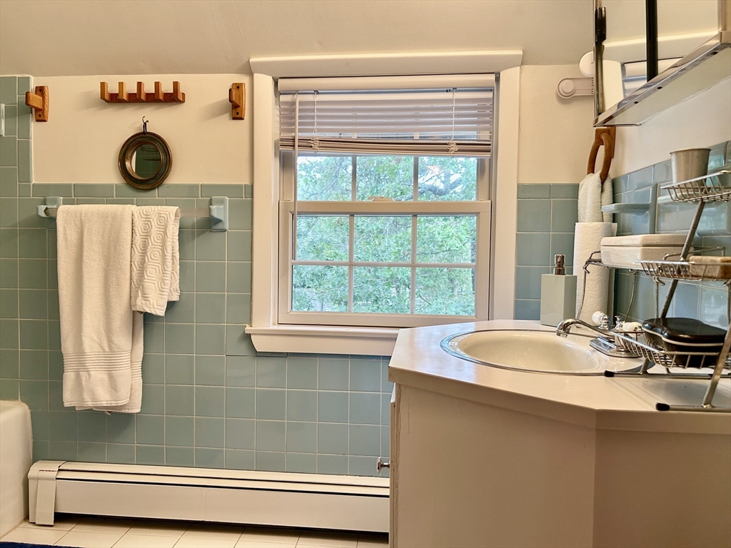 19 Rolling Acres Lane Falmouth, MA 02536 - Photo 10 of 27 a bathroom with a sink and a mirror