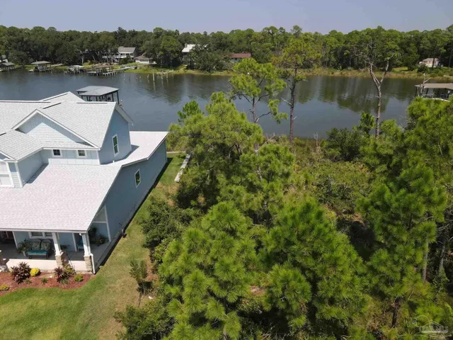 a view of a lake with a house in the background