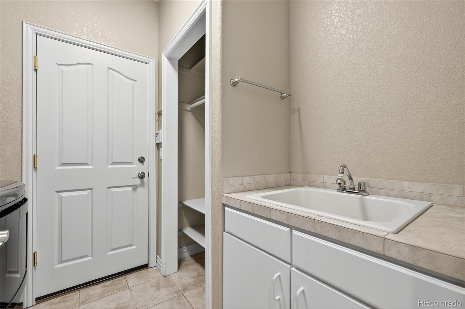 8389 Owl Roost Court Parker, CO 80134 - Photo 35 of 50 a bathroom with a sink and vanity