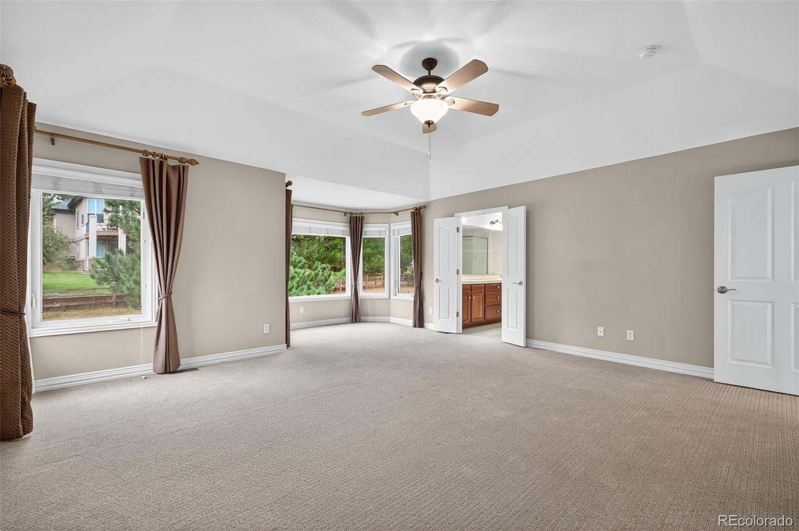 8389 Owl Roost Court Parker, CO 80134 - Photo 37 of 50 a view of an empty room with a window