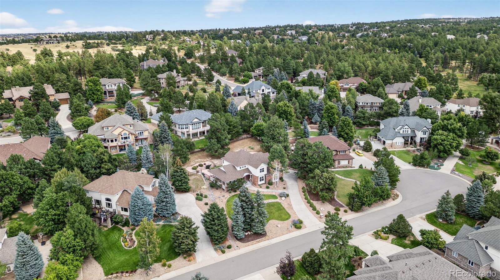 8389 Owl Roost Court Parker, CO 80134 - Photo 4 of 50 an aerial view of a city with lots of residential buildings