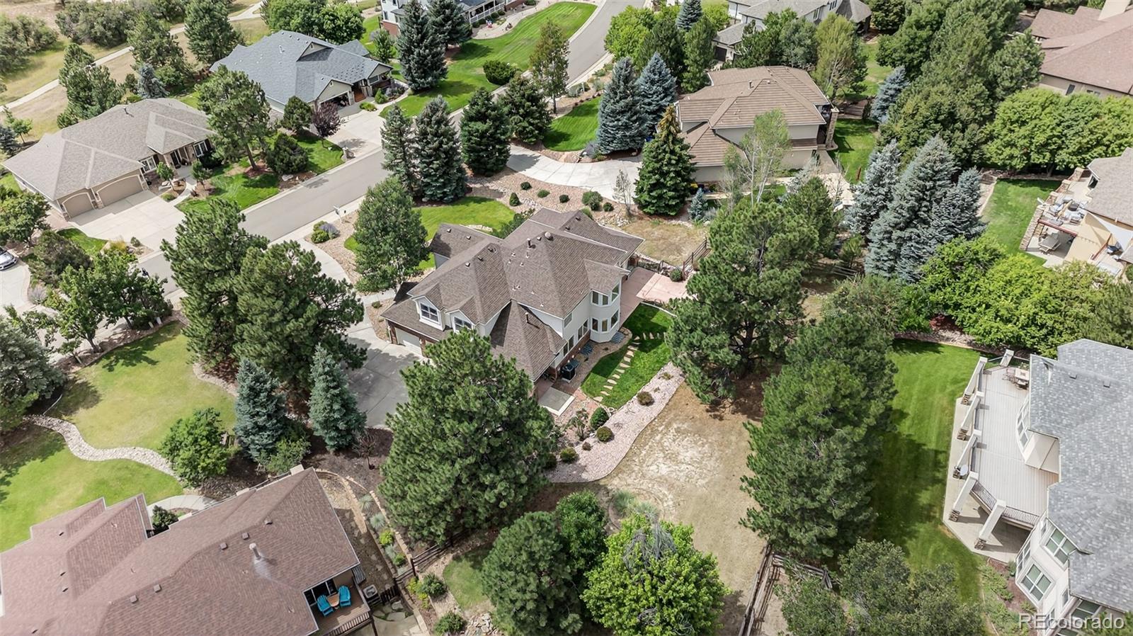 8389 Owl Roost Court Parker, CO 80134 - Photo 7 of 50 an aerial view of a house with outdoor space and lake view
