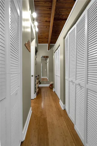 a view of a hallway with the wooden floor