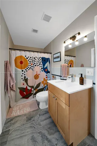 a utility room with sink dryer and washer