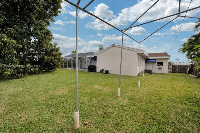 a house view with a backyard space