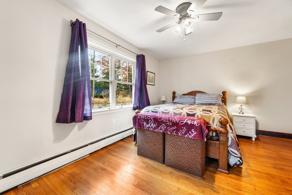 42 South Hunt Road Amesbury, MA 01913 - Photo 13 of 26 a bedroom with a bed and window