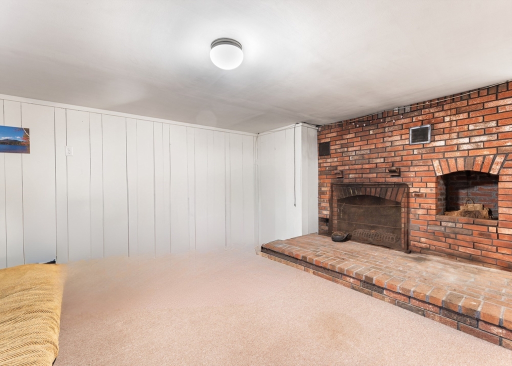 42 South Hunt Road Amesbury, MA 01913 - Photo 22 of 26 a view of an empty room and fire place