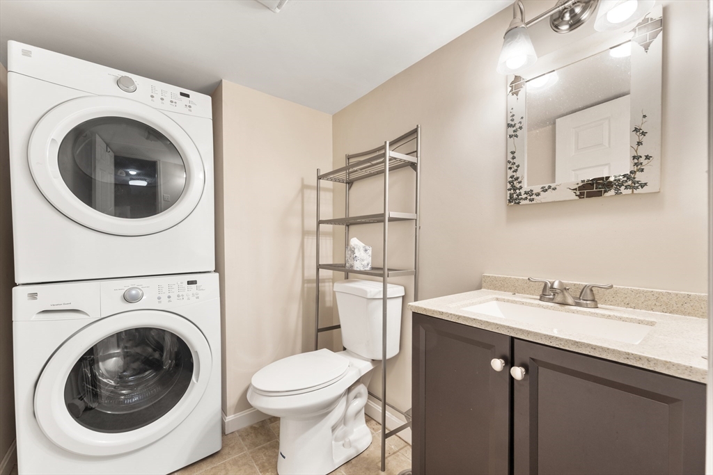 42 South Hunt Road Amesbury, MA 01913 - Photo 23 of 26 a bathroom with a sink a washer and dryer