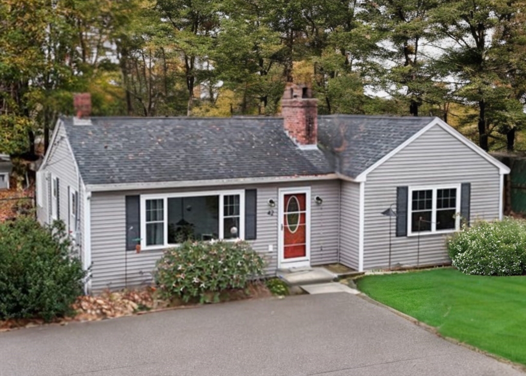 42 South Hunt Road Amesbury, MA 01913 - Photo 24 of 26 front view of a house with a garden
