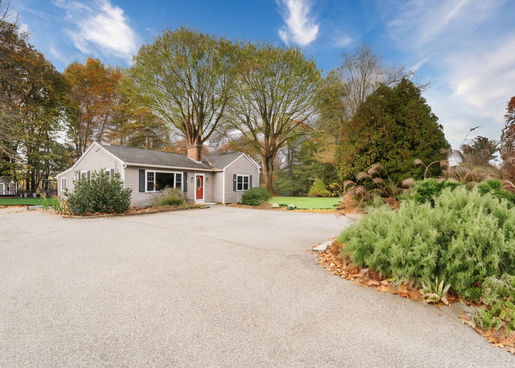 42 South Hunt Road Amesbury, MA 01913 - Photo 25 of 26 a front view of a house with a yard and garage