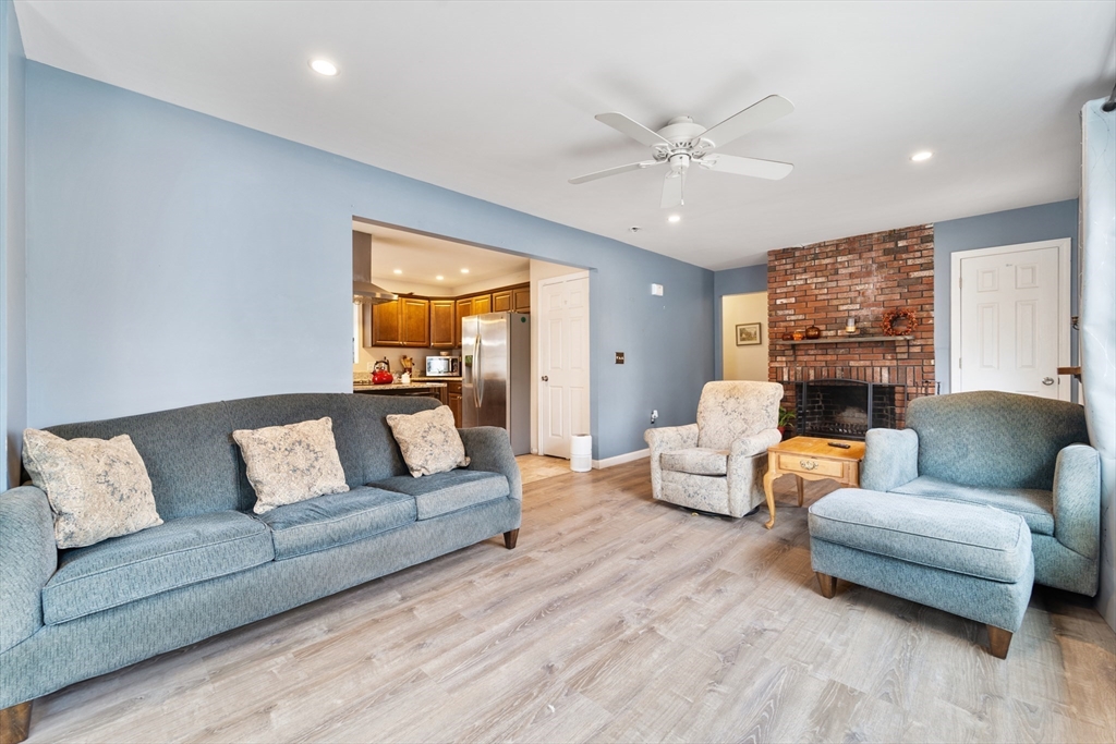 42 South Hunt Road Amesbury, MA 01913 - Photo 9 of 26 a living room with furniture and a large window
