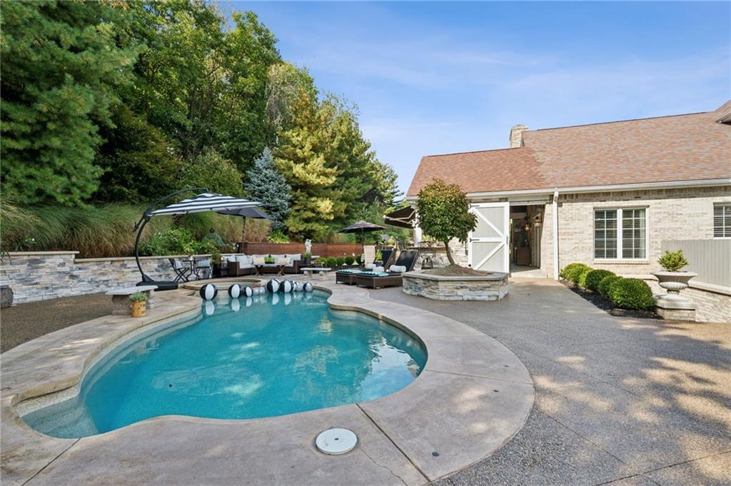 2080 St Ann Common Irwin, PA 15642 - Photo 43 of 50 a view of a swimming pool with chairs in patio