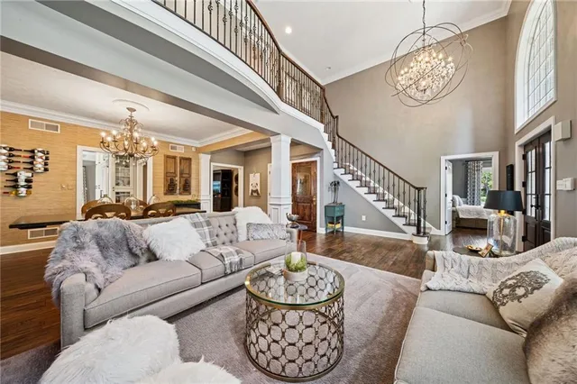 a living room with fireplace furniture and a flat screen tv
