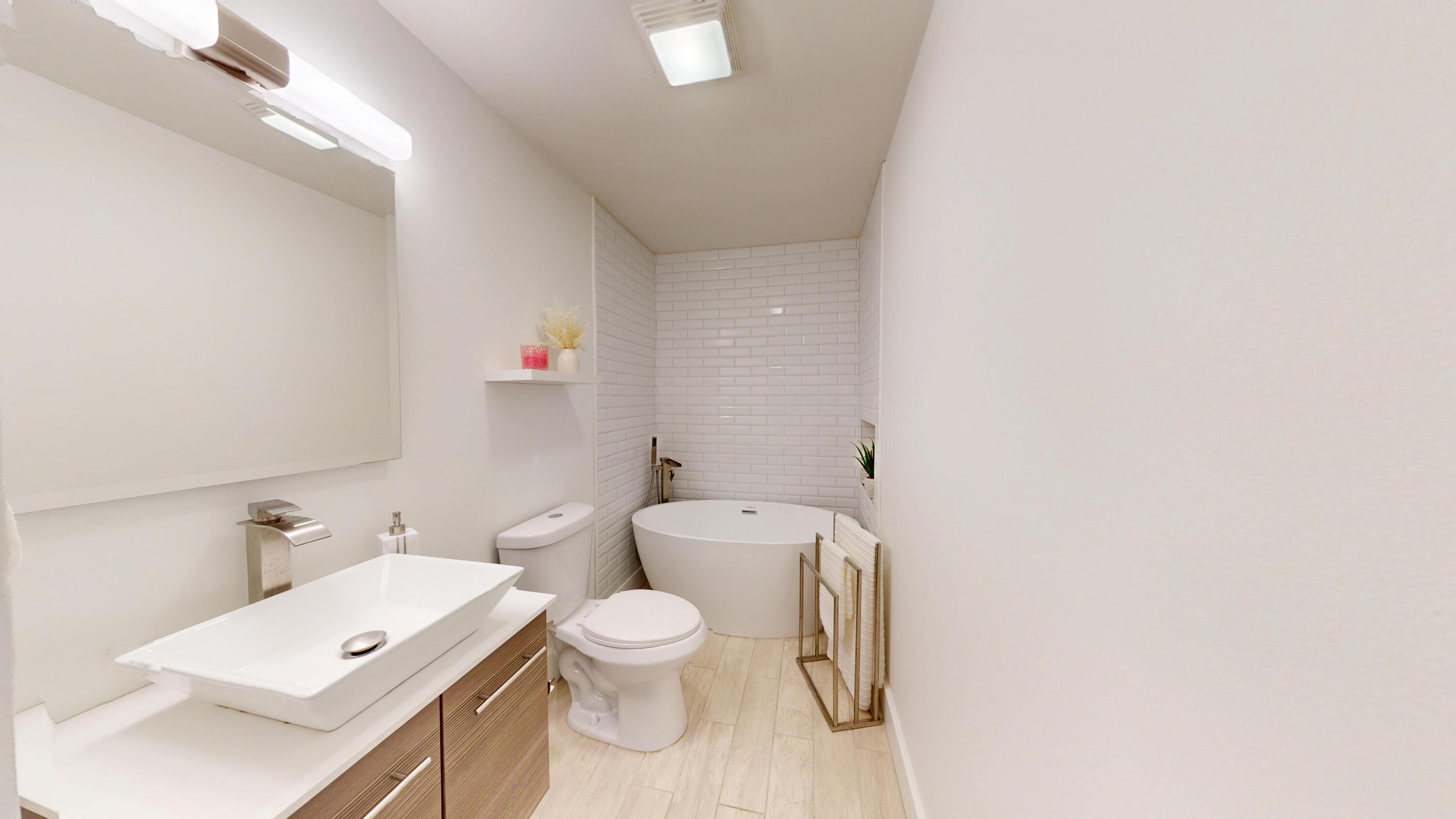 3064 Parkwood Place Crown Point, IN 46307 - Photo 11 of 40 a bathroom with a toilet sink and mirror