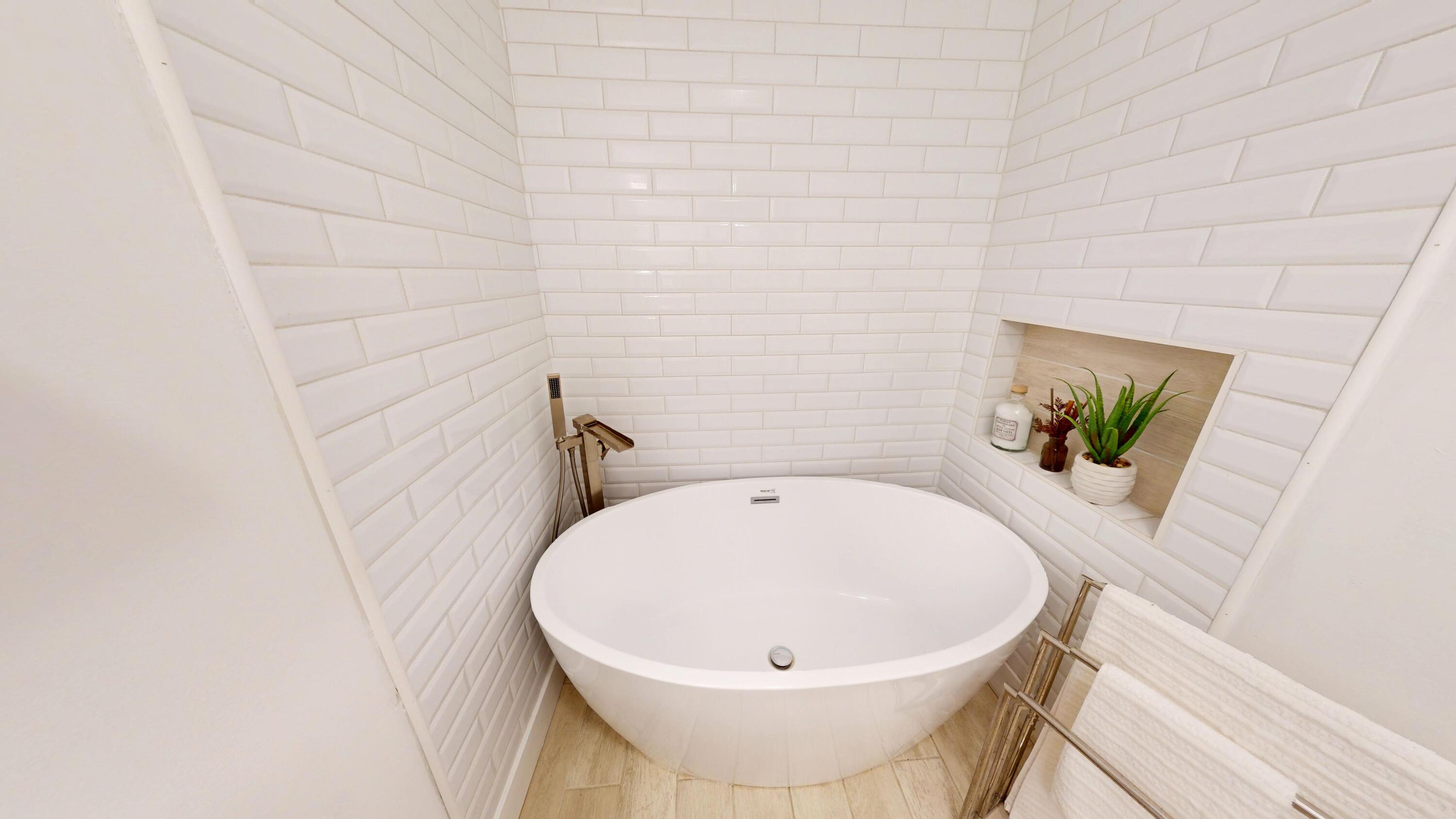 3064 Parkwood Place Crown Point, IN 46307 - Photo 13 of 40 a white bath tub sitting in a bathroom