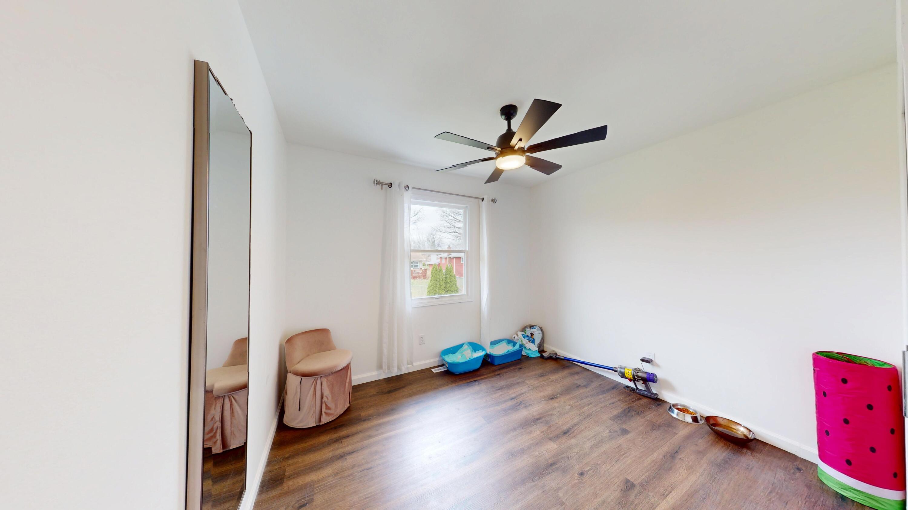 3064 Parkwood Place Crown Point, IN 46307 - Photo 14 of 40 a view of a room with a window and wooden floor