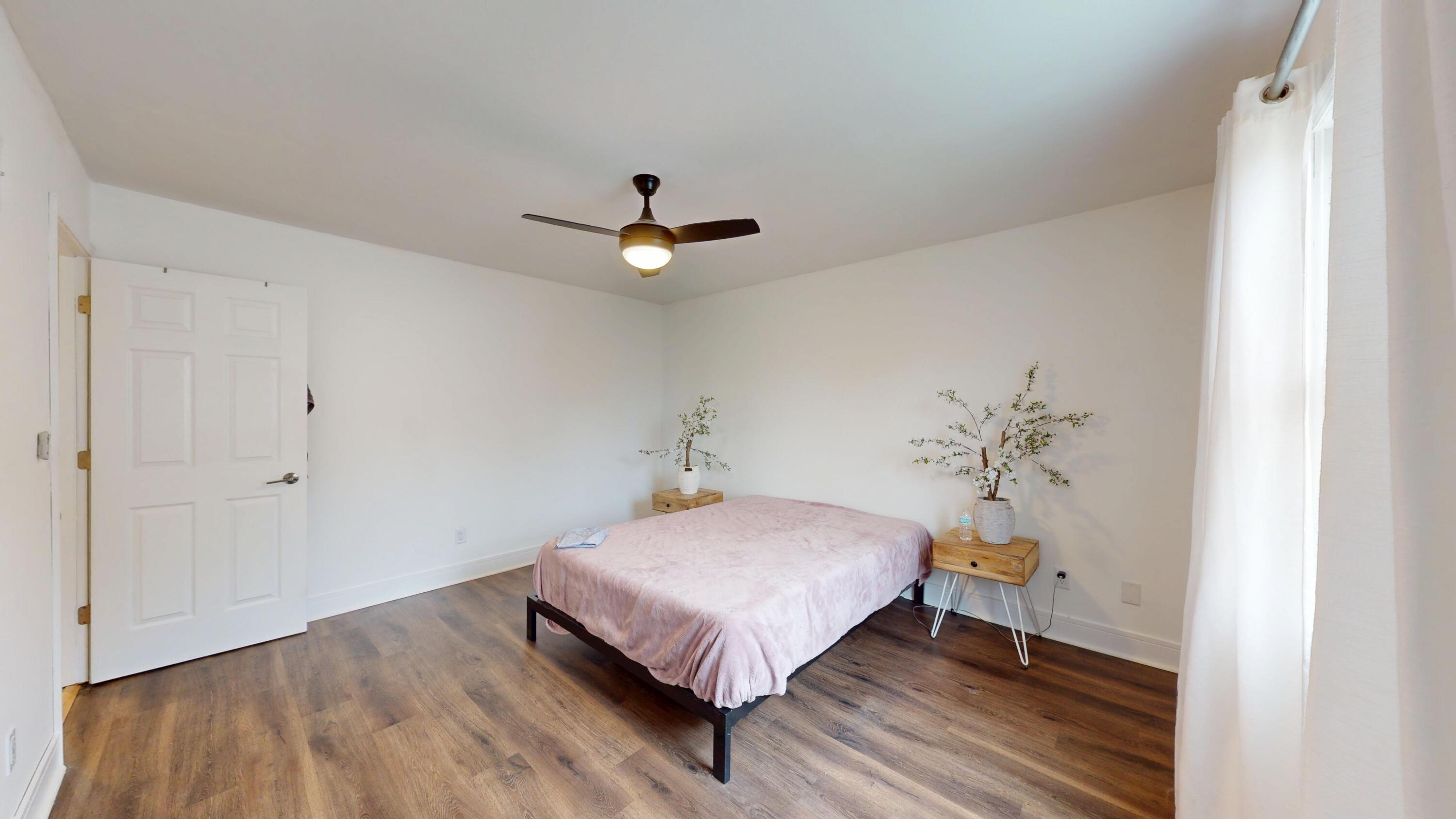 3064 Parkwood Place Crown Point, IN 46307 - Photo 19 of 40 a bed room with a bed and a chandelier