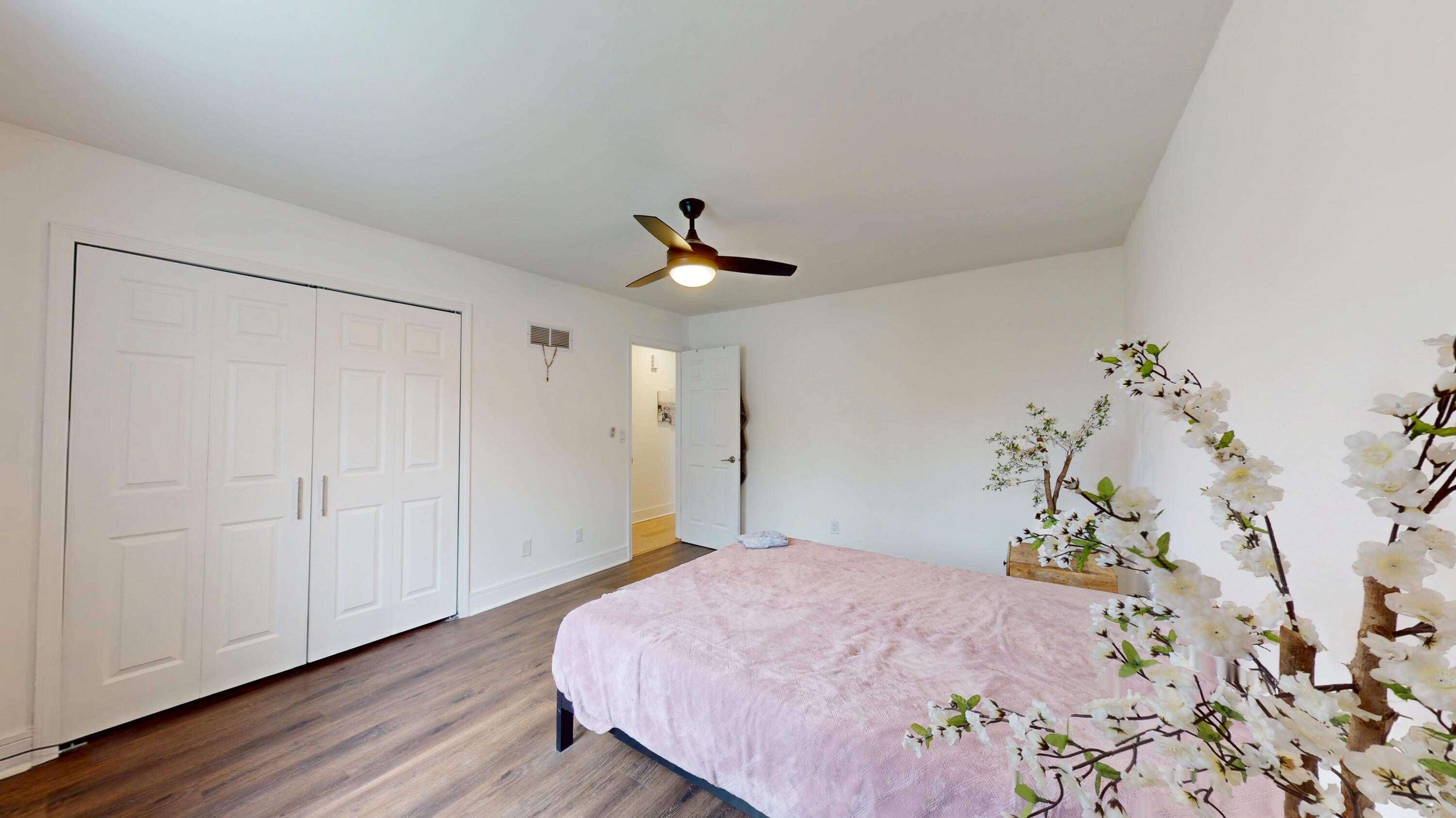 3064 Parkwood Place Crown Point, IN 46307 - Photo 20 of 40 a bedroom with a bed and a potted plant