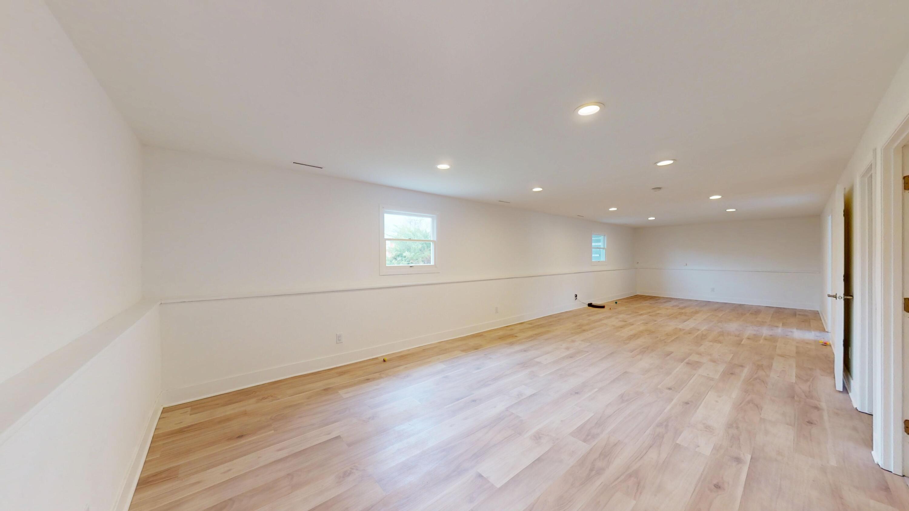 3064 Parkwood Place Crown Point, IN 46307 - Photo 26 of 40 an empty room with wooden floor and windows
