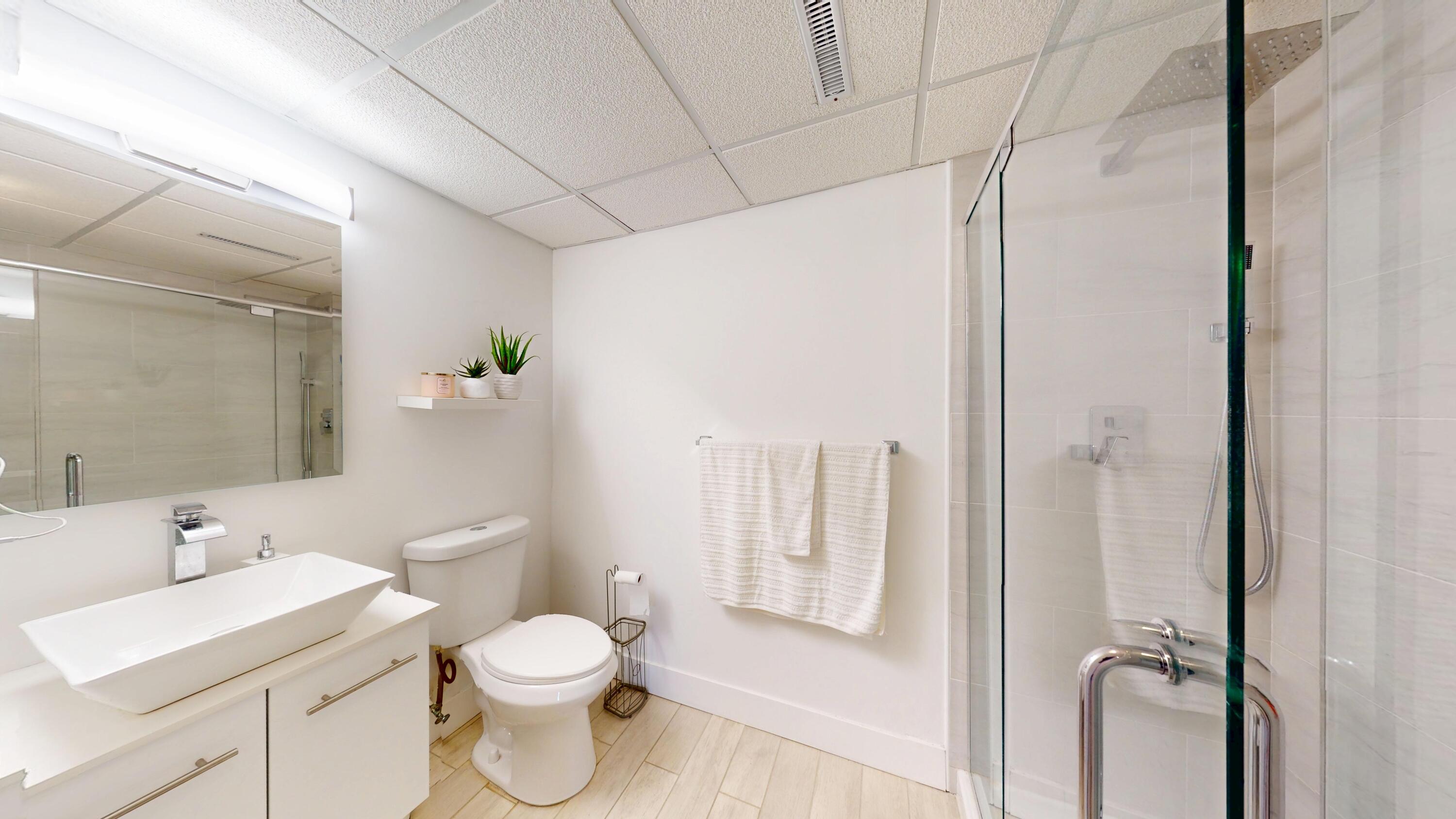 3064 Parkwood Place Crown Point, IN 46307 - Photo 31 of 40 a bathroom with a toilet a sink and a mirror