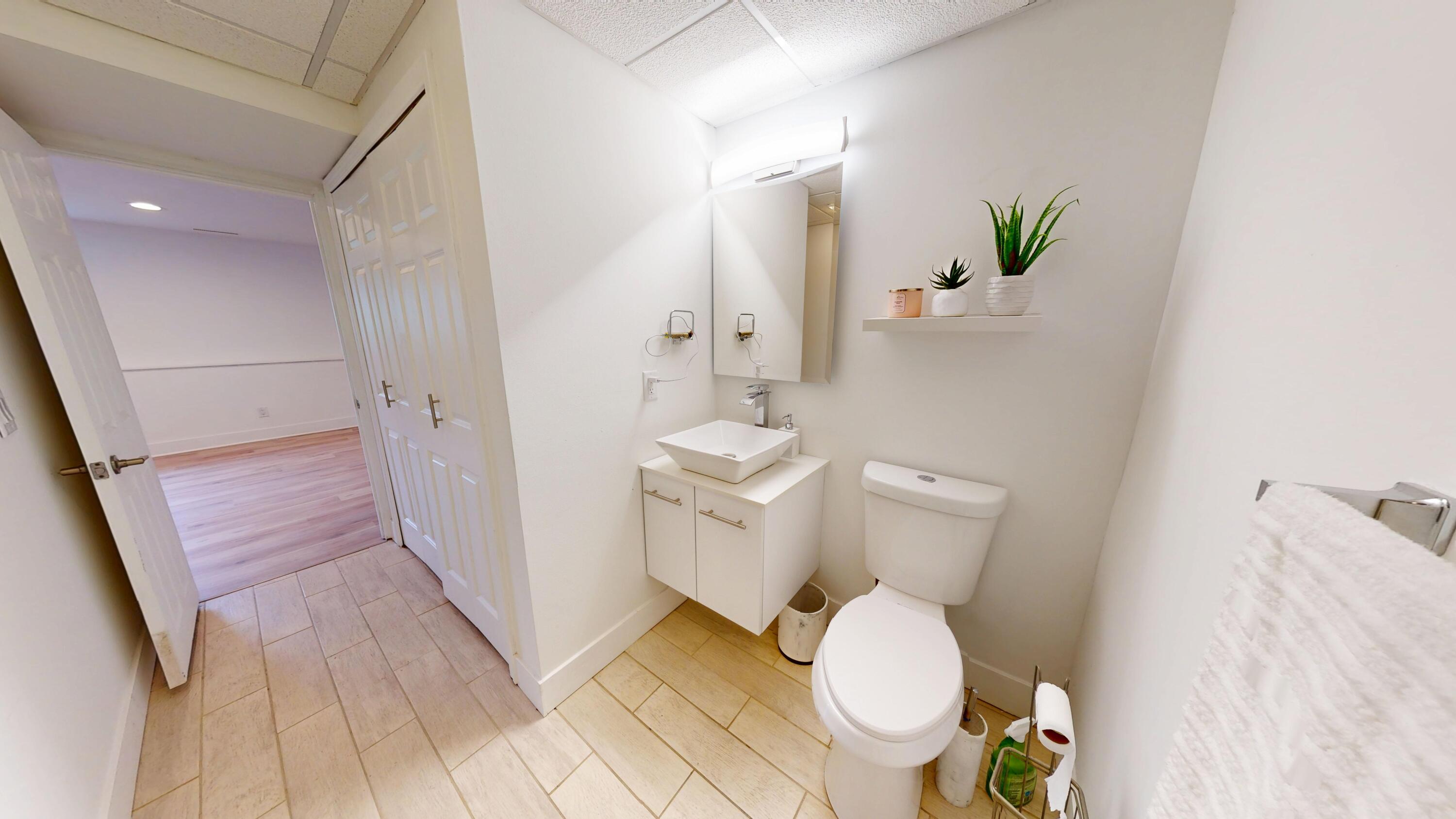 3064 Parkwood Place Crown Point, IN 46307 - Photo 32 of 40 a white toilet sitting next to a bathroom sink
