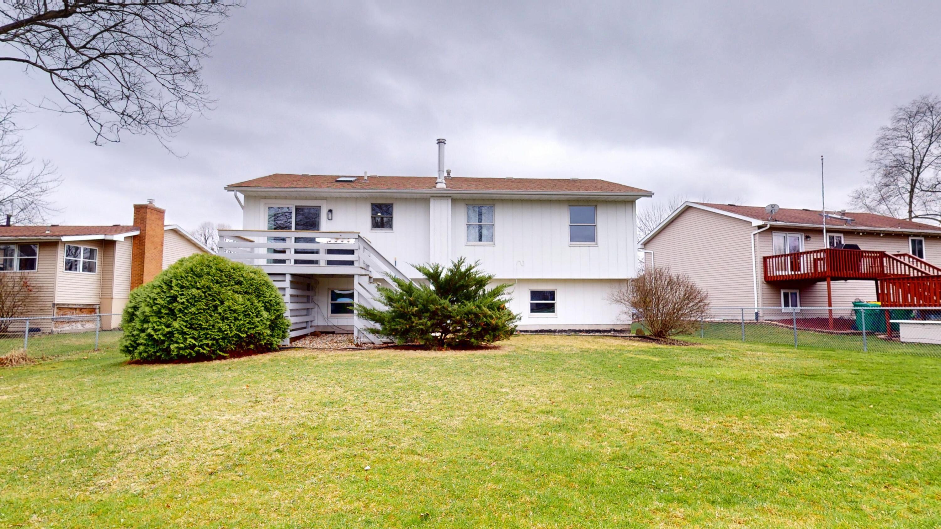 3064 Parkwood Place Crown Point, IN 46307 - Photo 36 of 40 a view of a house with a yard and a tree
