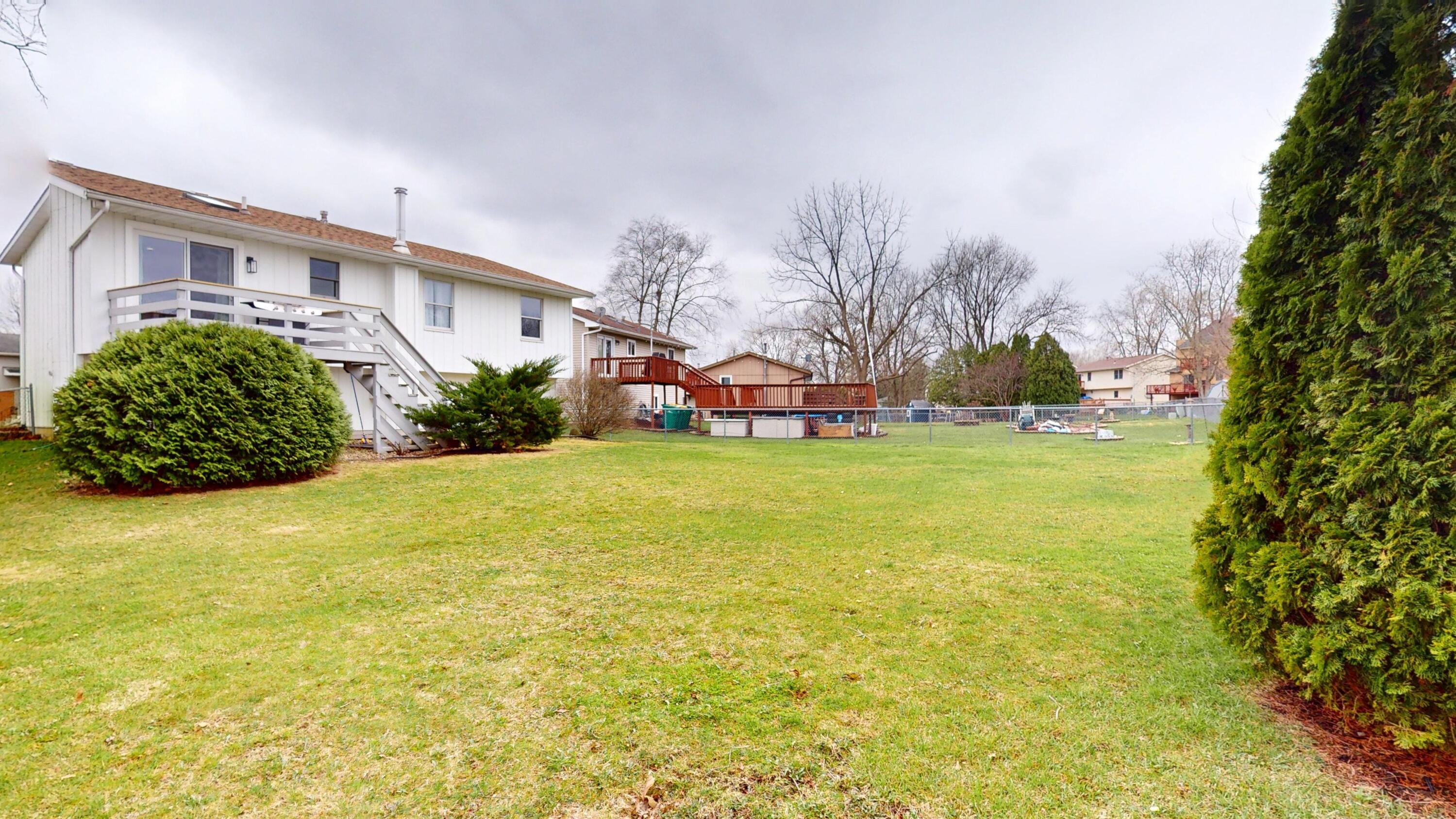 3064 Parkwood Place Crown Point, IN 46307 - Photo 37 of 40 a view of a house with a big yard and potted plants