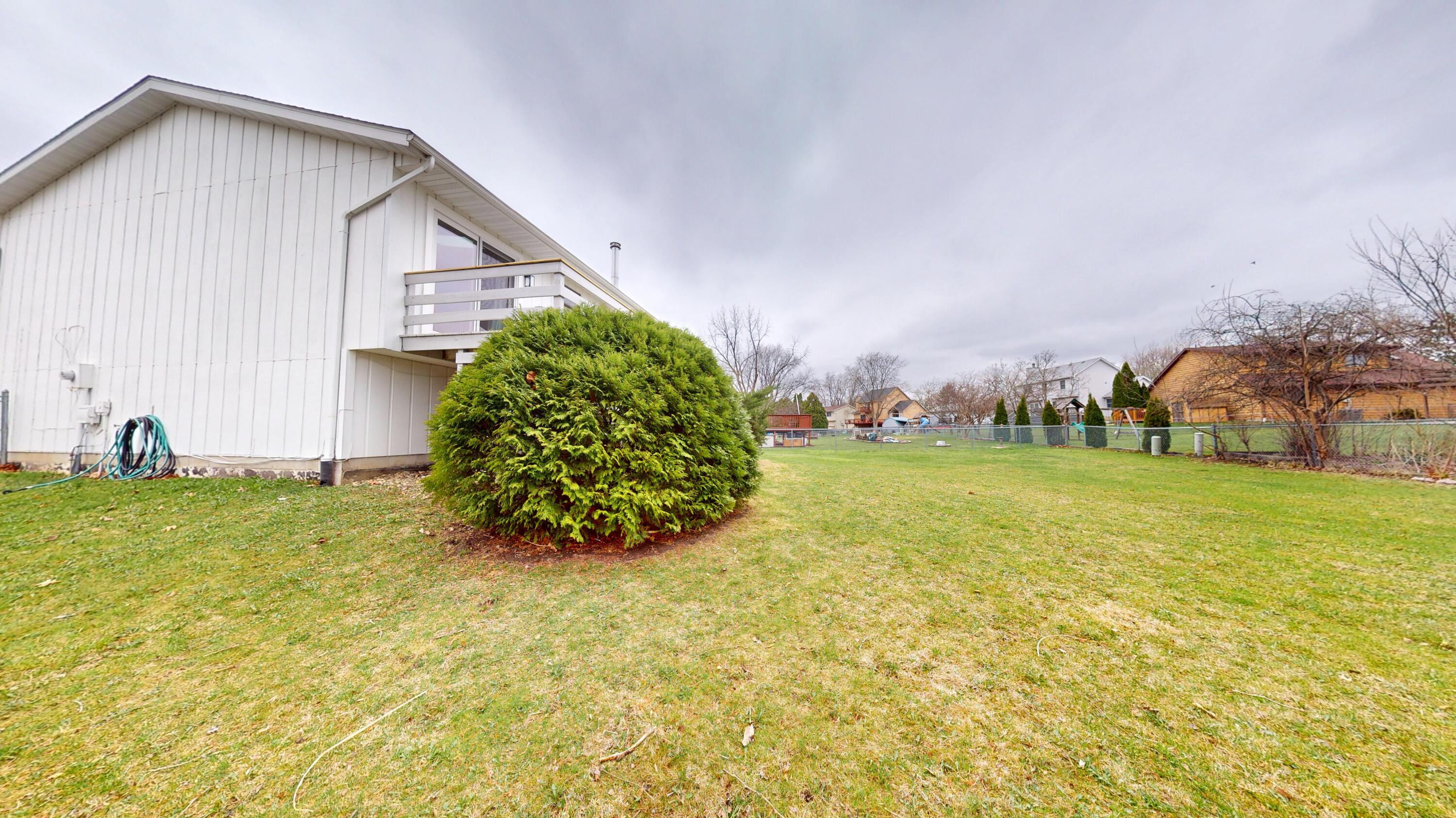 3064 Parkwood Place Crown Point, IN 46307 - Photo 38 of 40 a view of a backyard with plants and garden