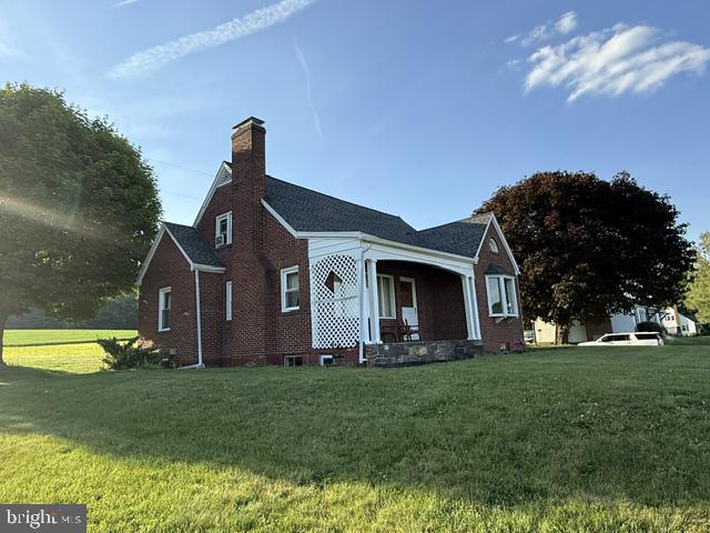 19642 Raystown Road James Creek, PA 16657 - Photo 5 of 42 Charming brick home in lush greenery.