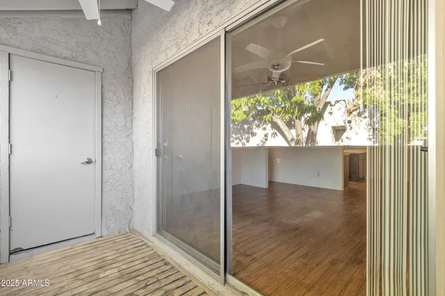 a view of hallway with wooden floor