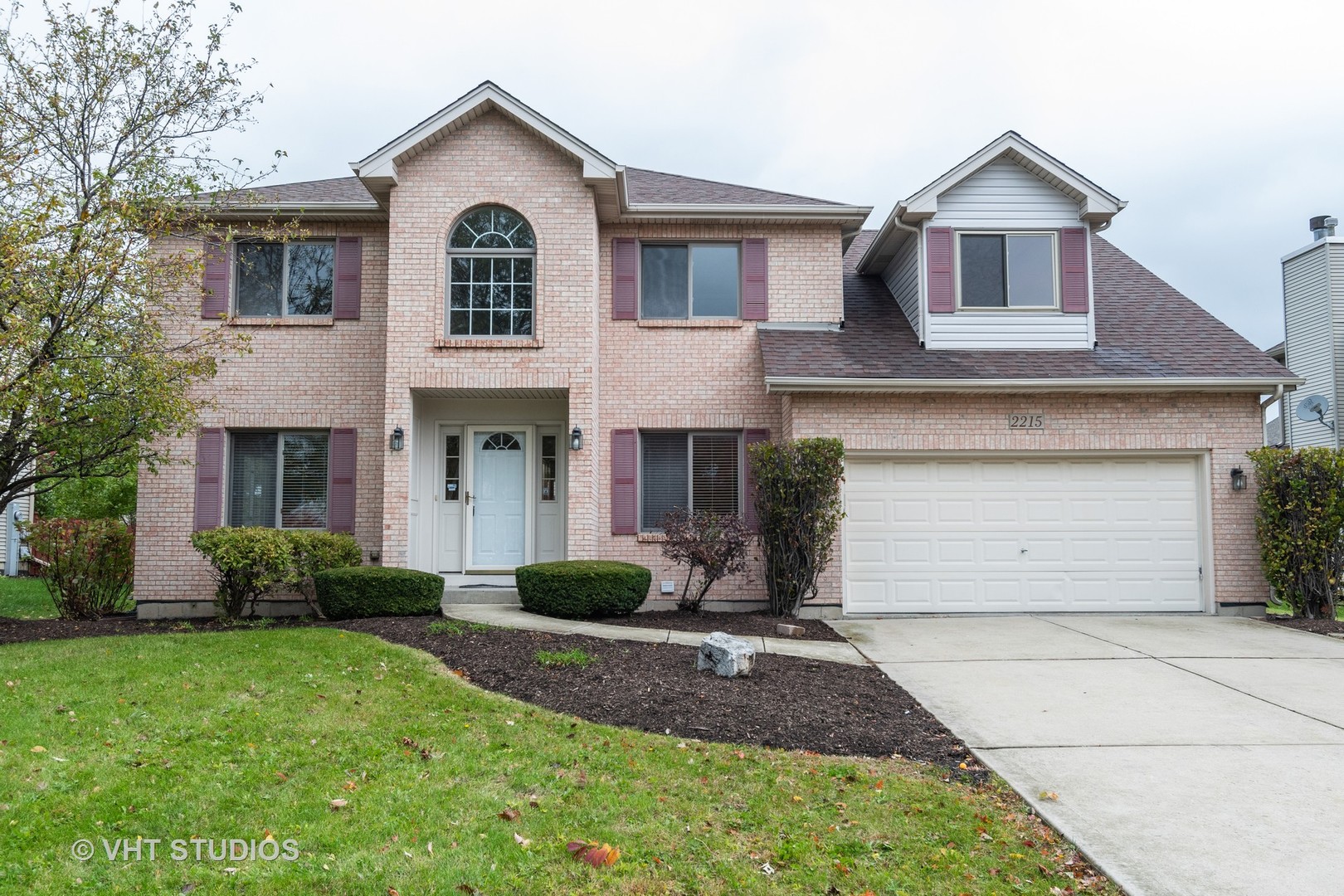 2215 Snow Creek Road Naperville, IL 60564 - Photo 1 of 18 a front view of a house with a yard and garage