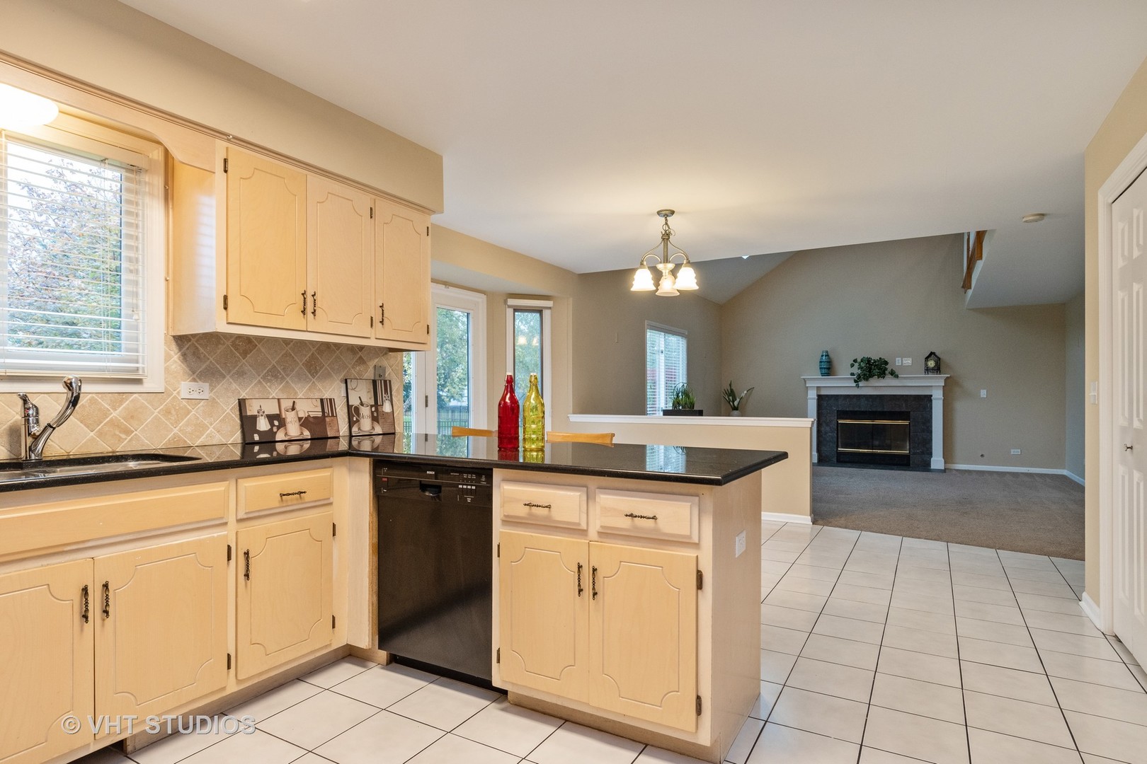 2215 Snow Creek Road Naperville, IL 60564 - Photo 6 of 18 a kitchen with a stove sink and cabinets