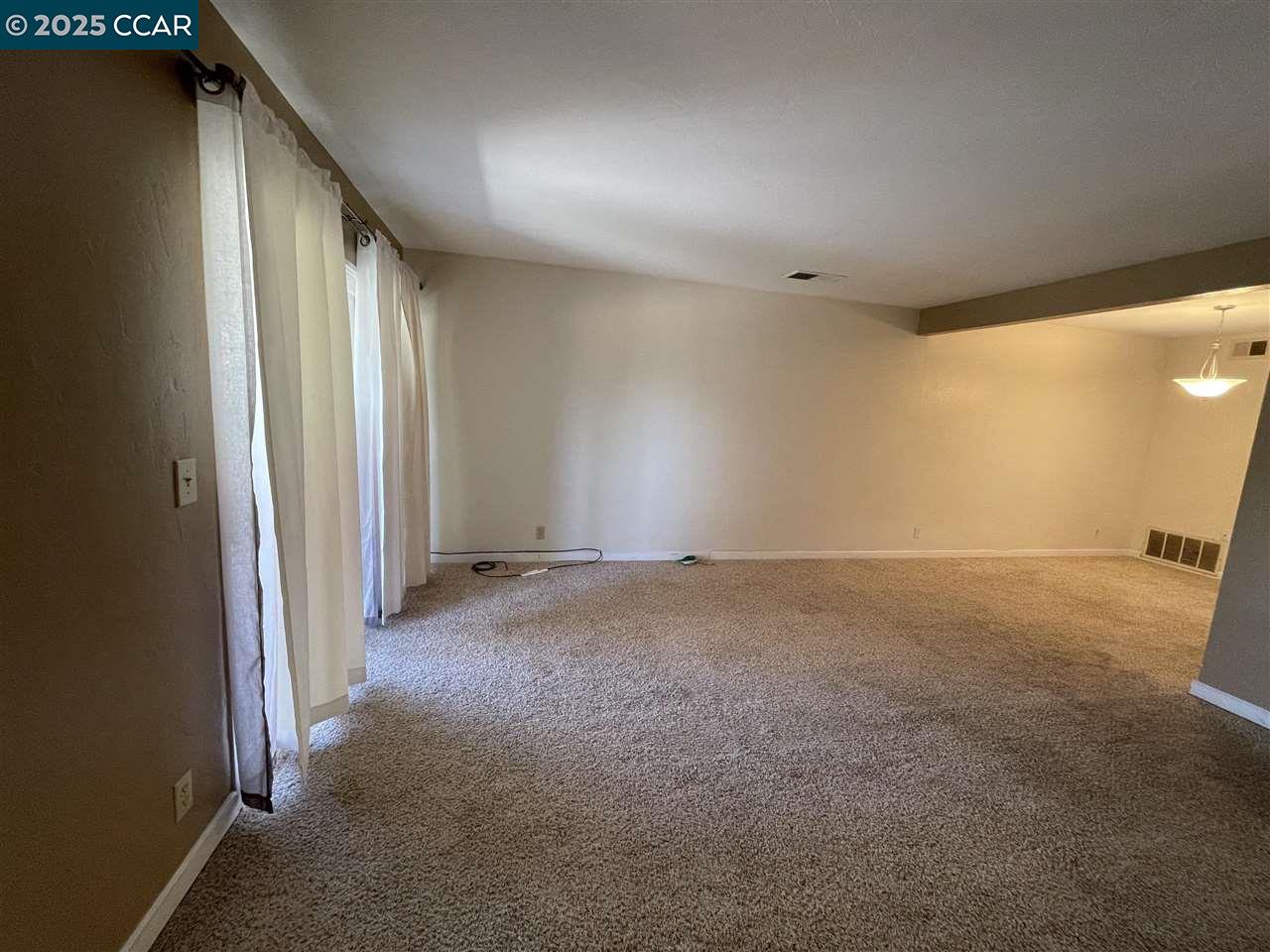 62 Villa Circle Fairfield, CA 94533 - Photo 3 of 10 a view of a big room with closet and windows