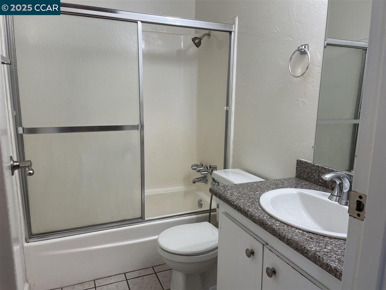 62 Villa Circle Fairfield, CA 94533 - Photo 6 of 10 a bathroom with a granite countertop sink toilet and shower