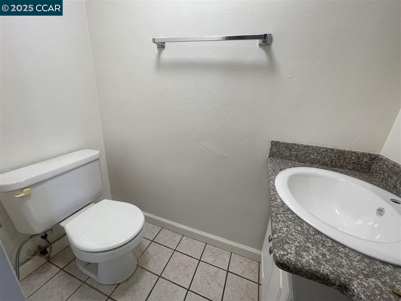 62 Villa Circle Fairfield, CA 94533 - Photo 10 of 10 a bathroom with a granite countertop toilet and a sink