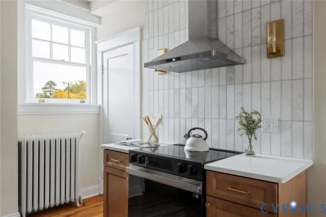 a kitchen with a stove and a cabinet