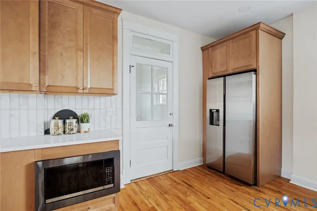 a room with a sink and cabinets