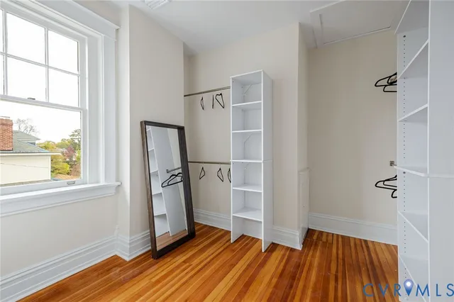 a bathroom with double vanity sink a mirror and a toilet