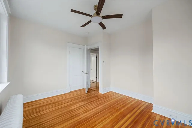 a bathroom with a bathtub a sink and a window